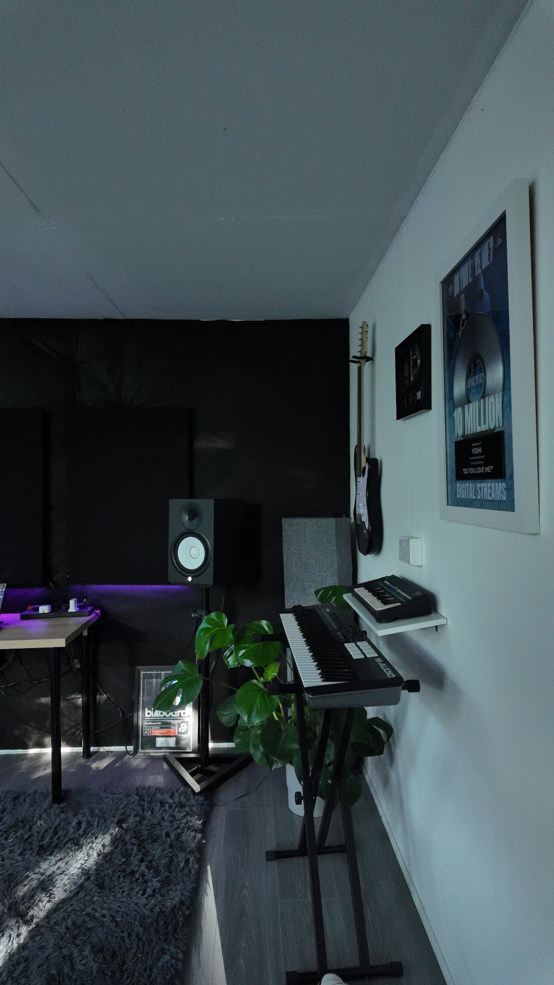 Yoshi Studio live room with a 10 million streams plaque for Do You Love Me?
